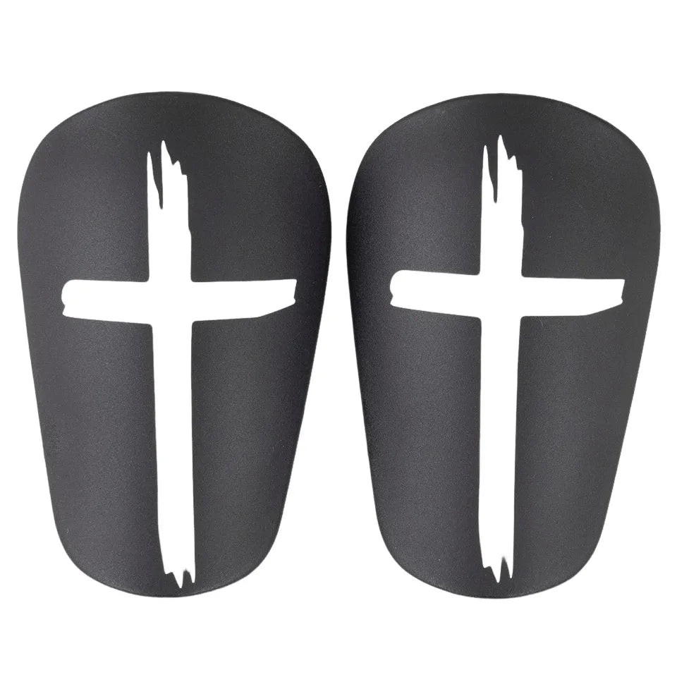 Black Cross mini shin pads — pair of black pads with white crosses